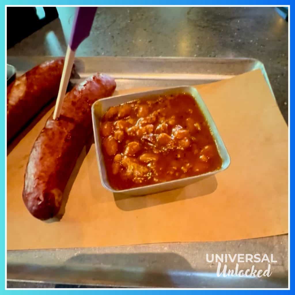Sausage and baked beans at the Oak & Star Tavern, a new restaurant at EPIC Universe with great gluten free options