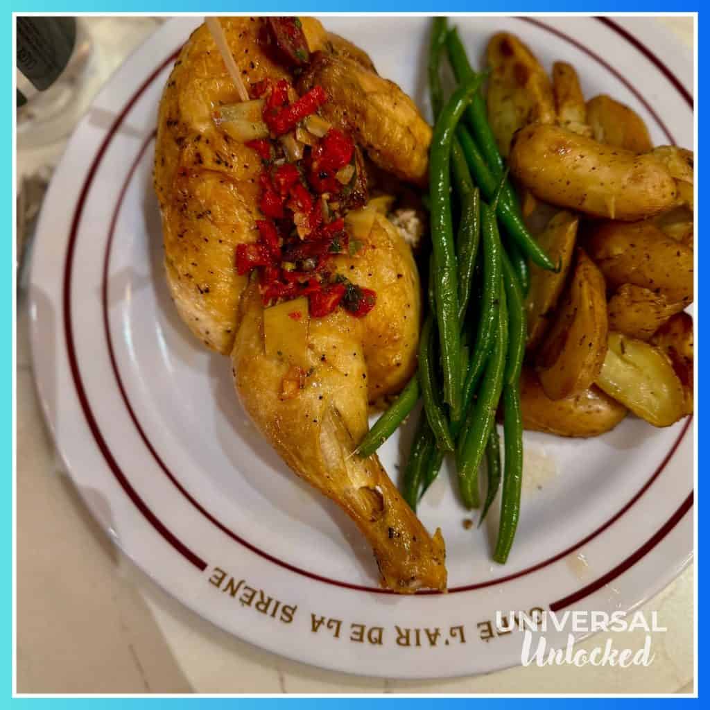 Half Chicken, potatoes, and Green Beans at Café L’air De La Sirène™ in the Wizarding World of Harry Potter - Ministry of Magic at EPIC Universe