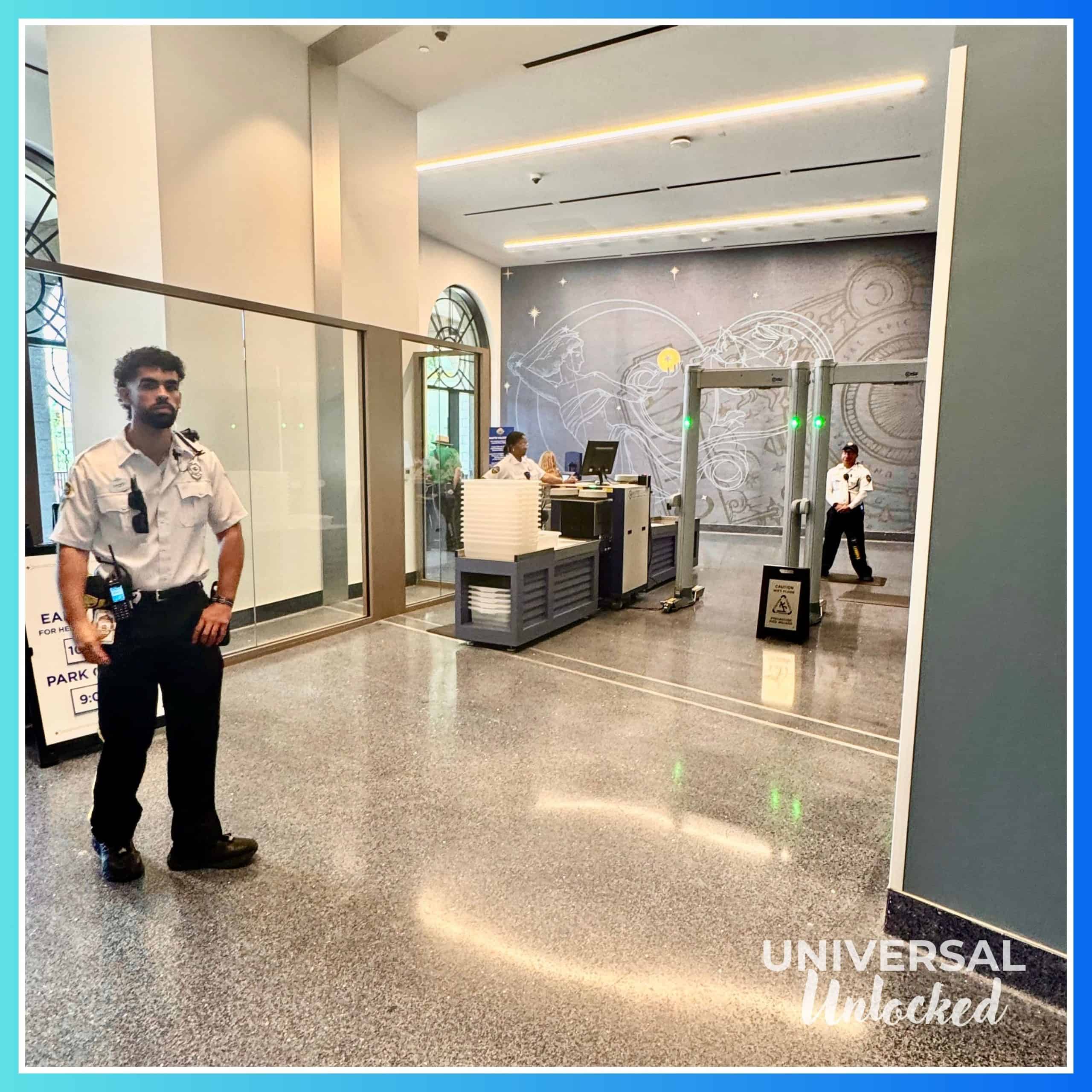 Metal detectors and EPIC Universe park entrance at the Helios Grand Hotel 