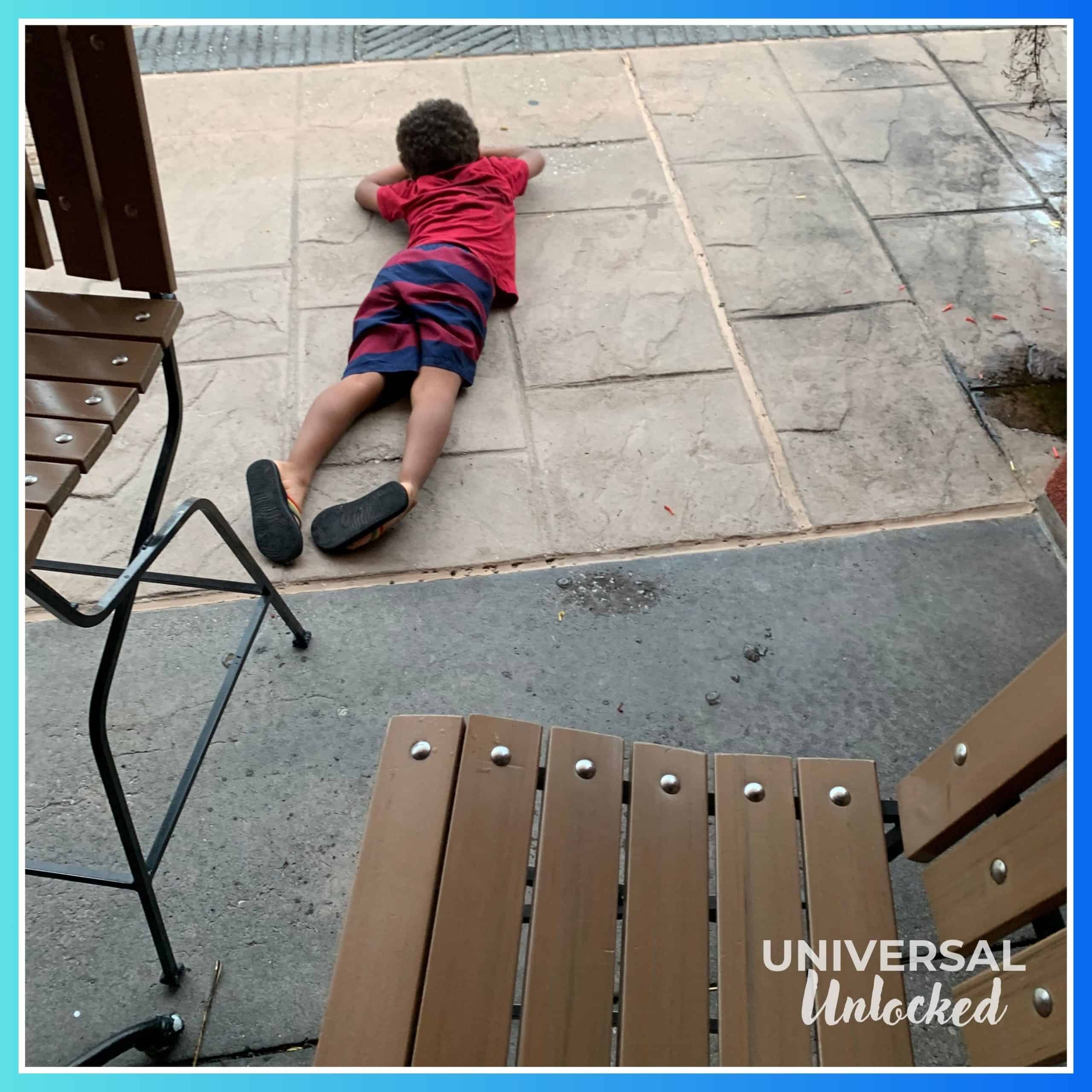 An Universal Unlocked child resting at the Thirsty Fish after a long day at the parks