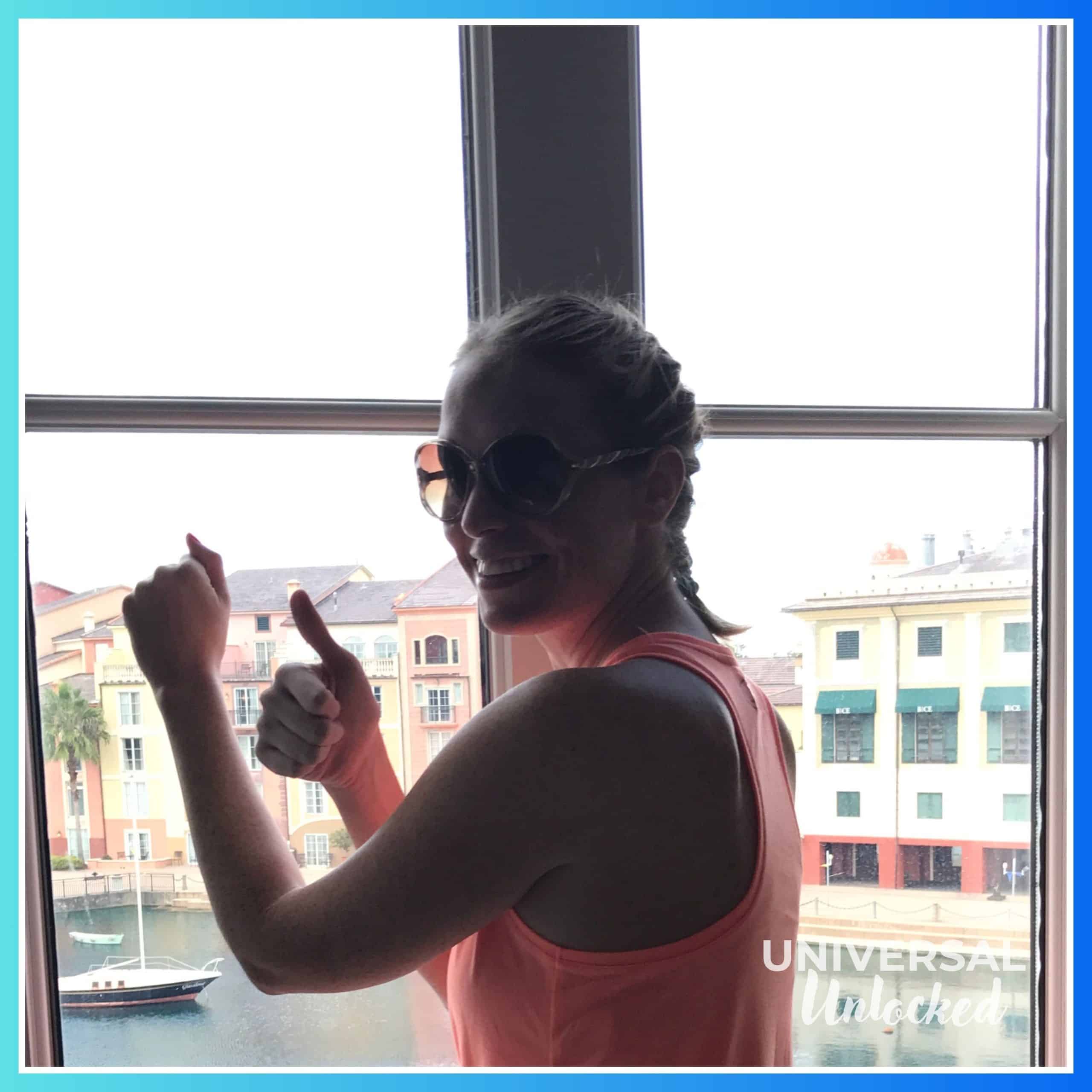 Laney testing the hurricane proof windows at the Portofino Bay Hotel (cameo by BICE)