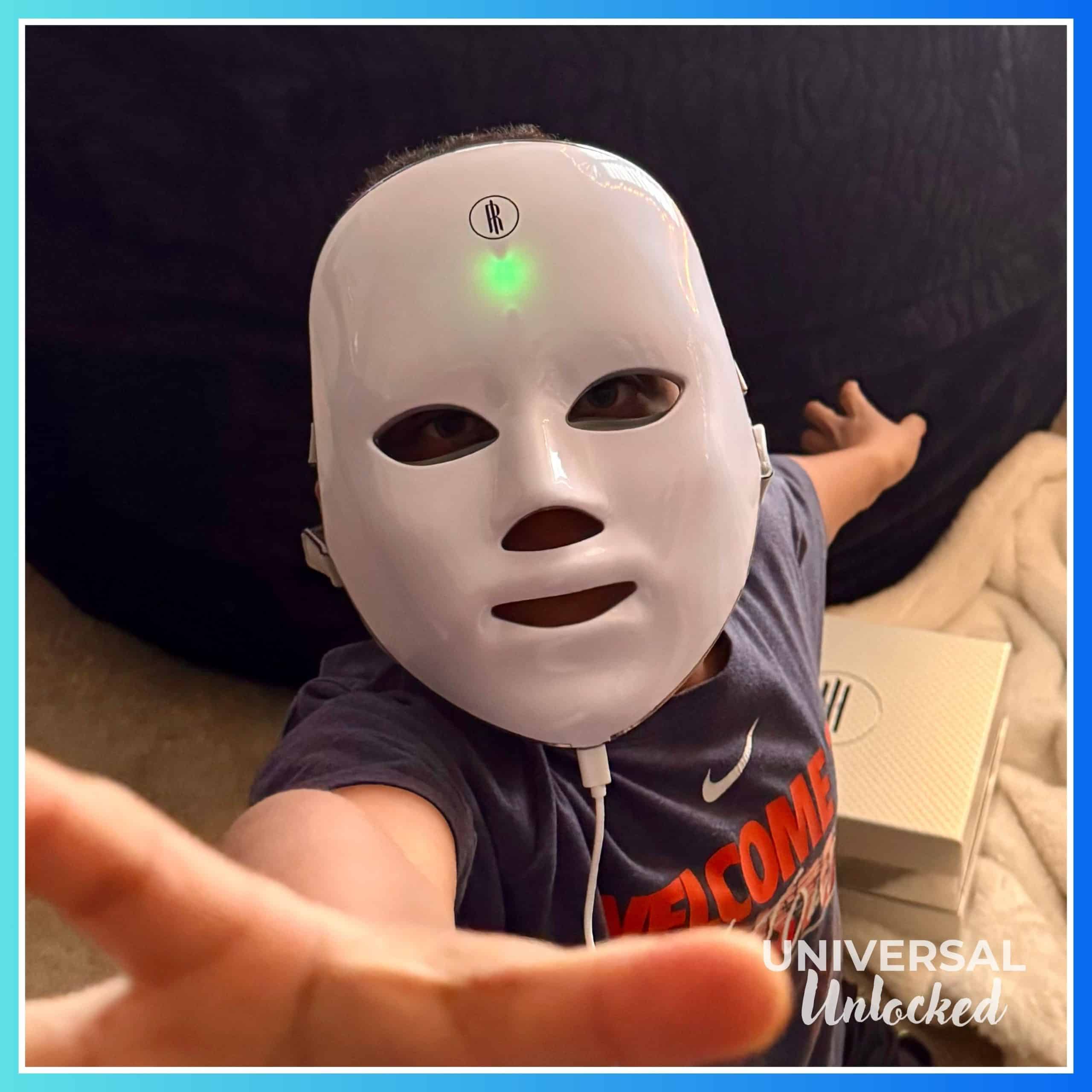 The Unlocked child wearing our favorite red light mask. He tries to stay young.