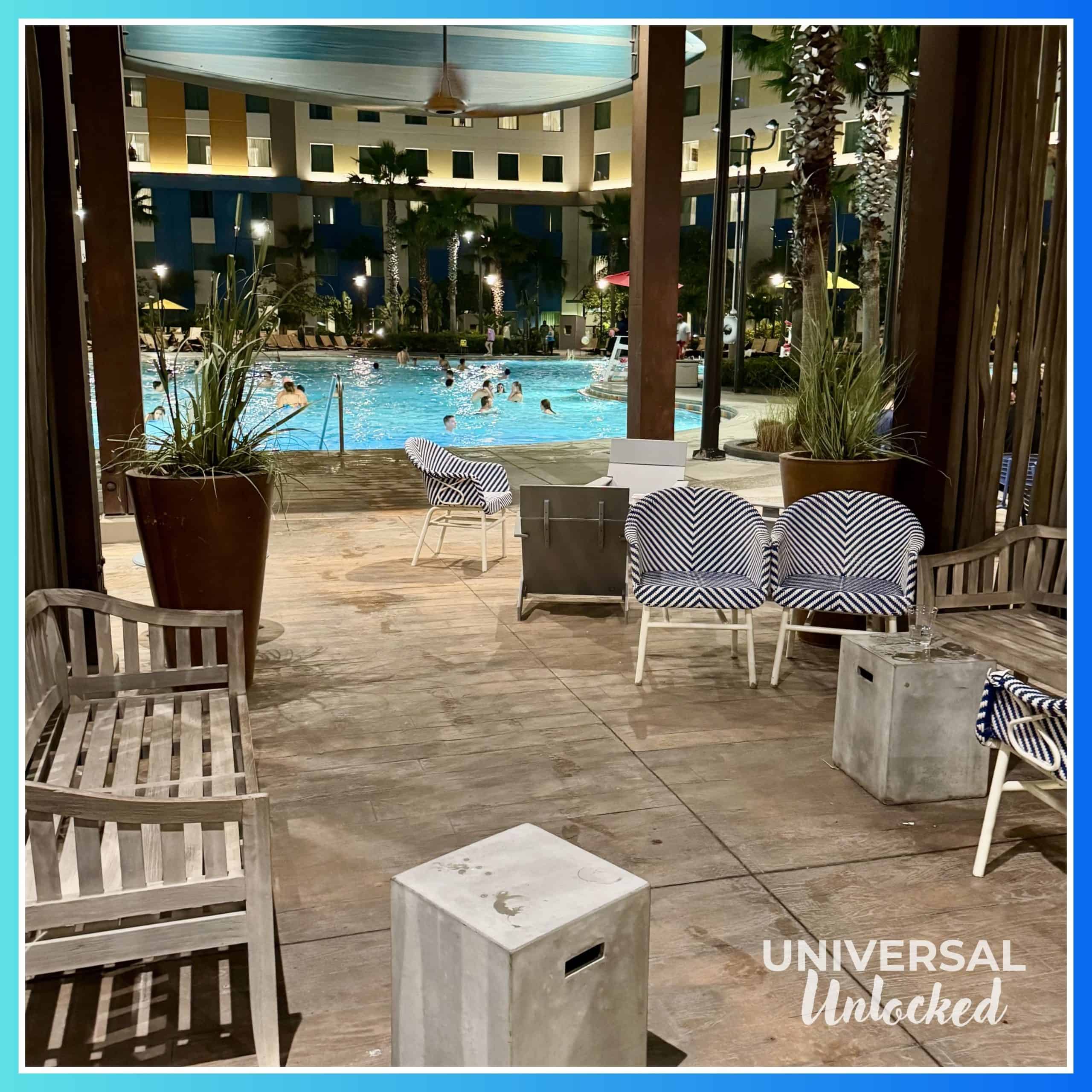 Night views of the pool area and bar lounge at Dockside Inn and Suites