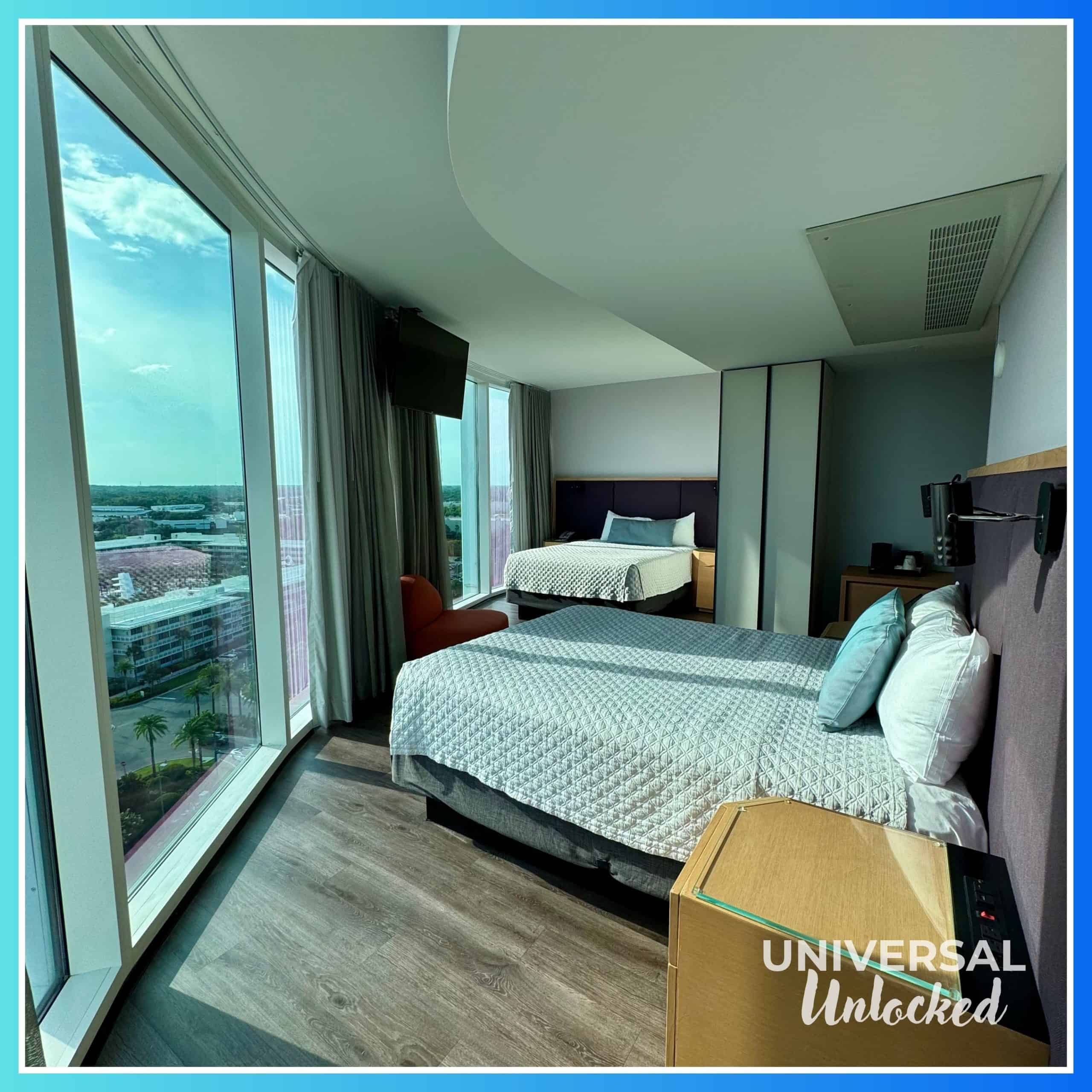 Aventura deluxe room with floor to ceiling windows.